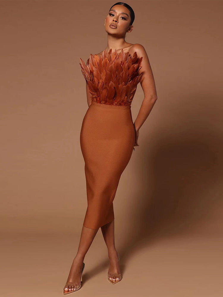 GR women's dress with waist accentuation and feather embellishment