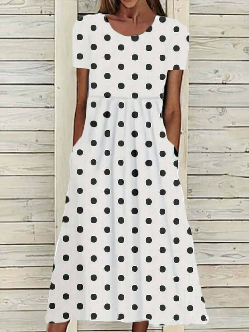 GR | Airy, short-sleeved, polka-dotted dress with a round neckline